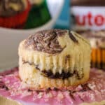 nutella muffin sitting on a cupcake wrapper.