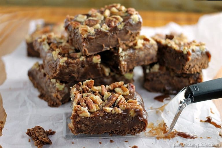 Salted Chocolate Caramel Bars start with a layer of chocolate shortbread, topped with a thick layer of homemade salted caramel, and finished off with toasted pecans. | Persnickety Plates