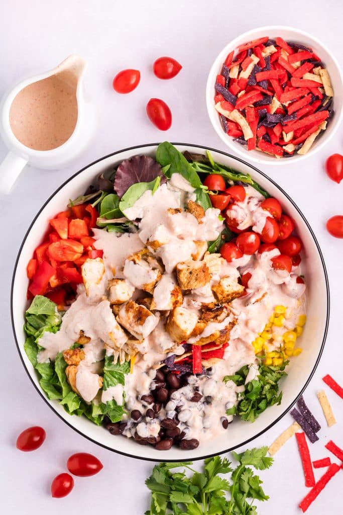 salsa dressing poured over a salad.