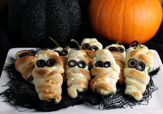 Jalapeno Popper Mummies wrapped in Rhodes bread "bandages" make a spicy and spooky treat for your next Halloween party! | Persnickety Plates
