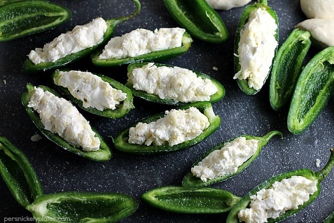 Jalapeno Popper Mummies wrapped in Rhodes bread "bandages" make a spicy and spooky treat for your next Halloween party! | Persnickety Plates