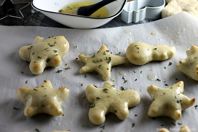 christmas shaped dinner rolls on a baking sheet