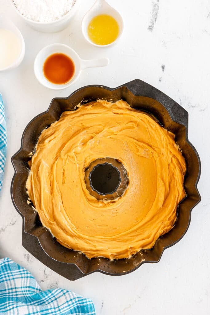 overhead shot of butterscotch cake batter in a bundt pan.
