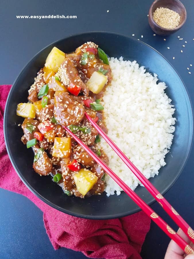 sweet & sour pork in bowl with chopsticks and rice This March Meal Plan includes easy dinners, sides, and desserts to help you save time and plan ahead. Menu planning made easy with recipes for the month. | www.persnicketyplates.com