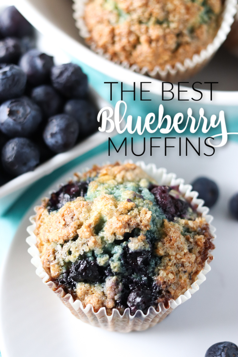 These Blueberry Muffins have a tender, buttermilk crumb, are full of blueberry flavor, and are topped with a crunchy sugary topping. Start your day off right with a batch of the best blueberry muffins! | www.persnicketyplates.com blueberry muffin on a white plate with blueberries in background