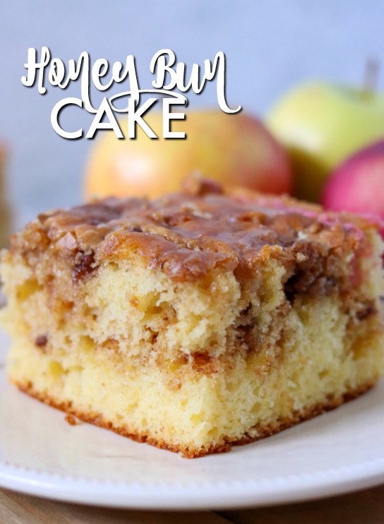 honey bun cake slice on white plate with text overlay