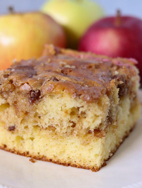 slice of honey bun cake surrounded by apples