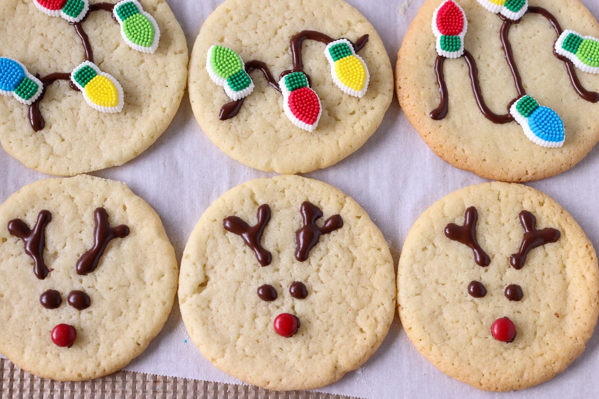 reindeer and christmas light cookies on a baking sheet
