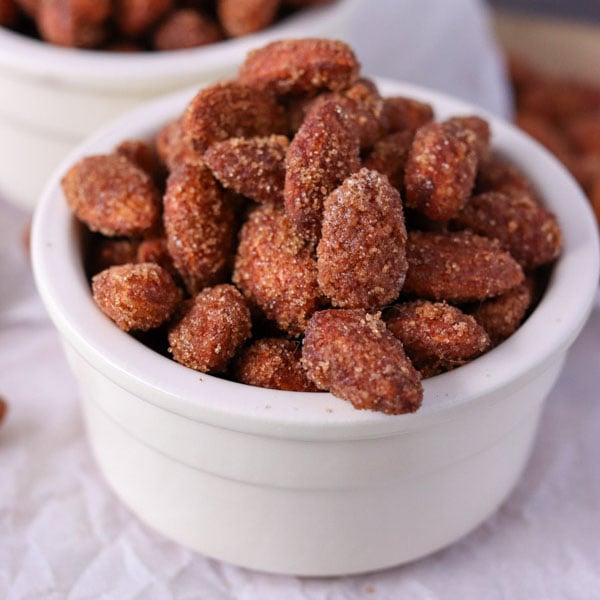 cinnamon sugar candied almonds in white bowl