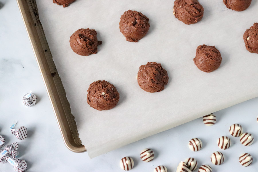 cookie dough on a baking sheet ready for the oven