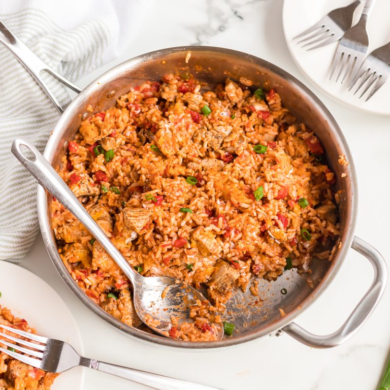 overhead shot of chicken skillet with forks