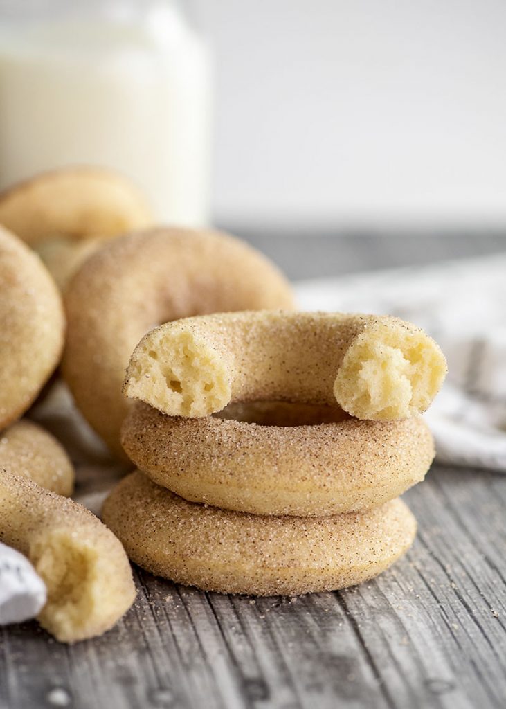 stack of donuts with one broken in half