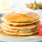 stack of pancakes covered in syrup