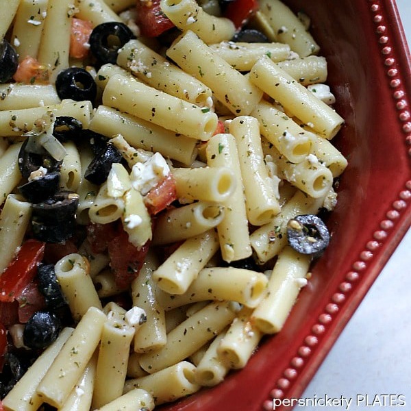 overhead shot of red bowl of pasta salad
