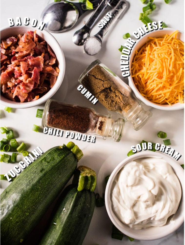 overhead shot of ingredients laid out to make loaded zucchini skins