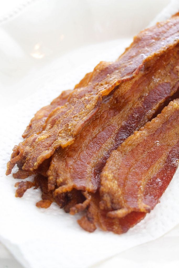 stack of crisp bacon on a paper towel