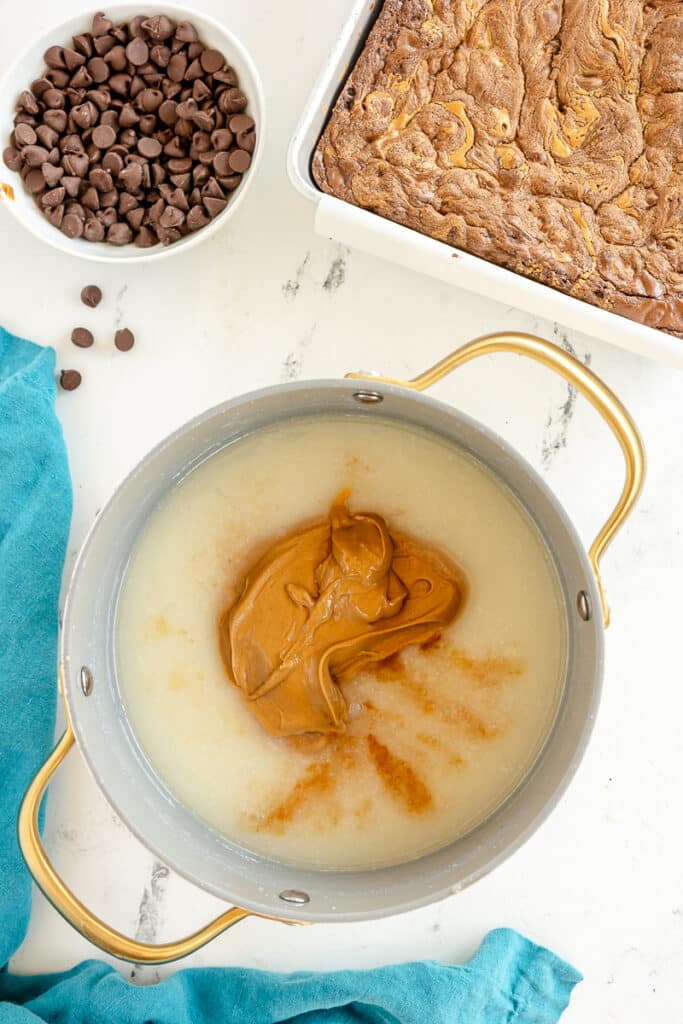 peanut butter in a saucepan making frosting.