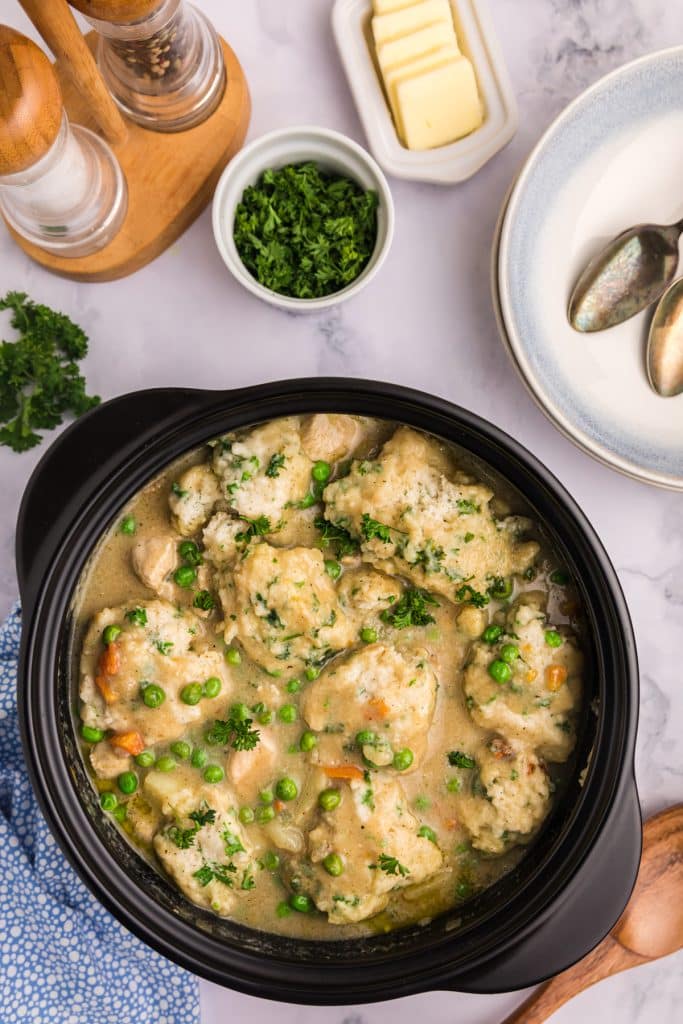 overhead shot of chicken and dumplings in a pot.