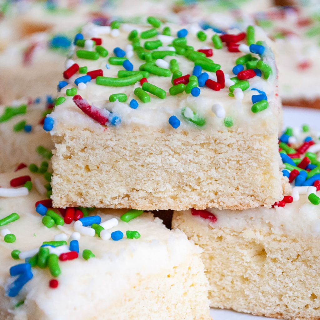 close up of stack of sugar cookie bars with colorful sprinkles