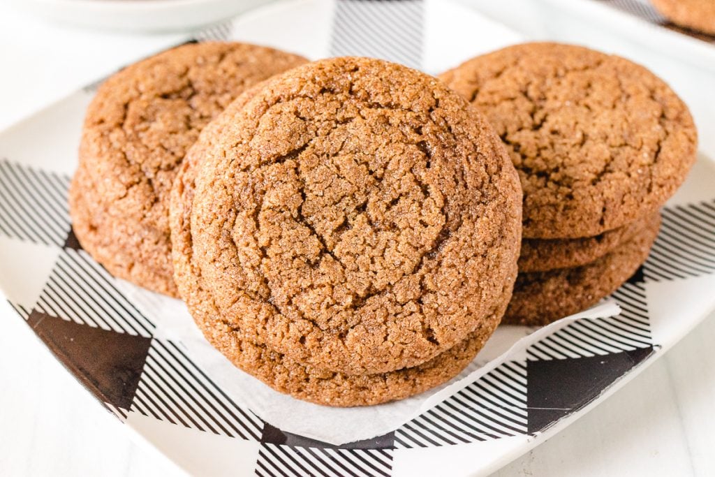close up of molasses cookie on a buffalo plaid plate