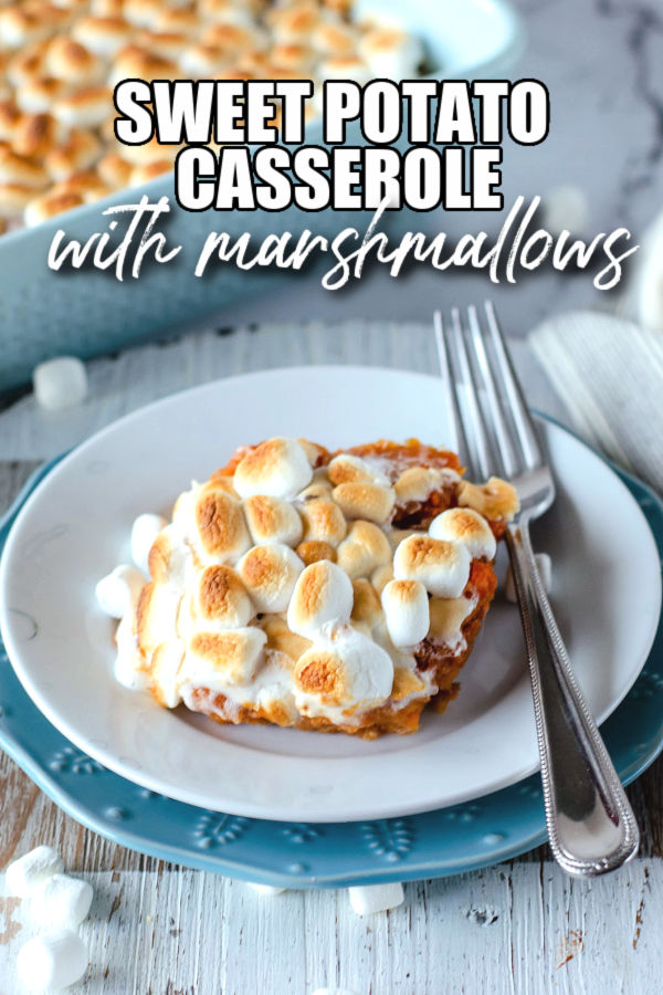 portion of marshmallow topped sweet potato casserole on a white plate