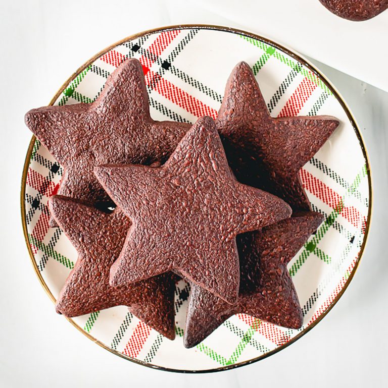 plate of star shaped chocolate shortbread cookies