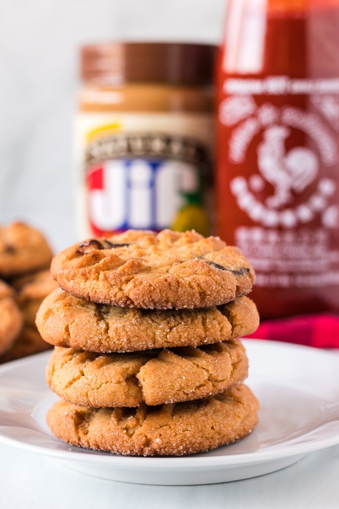 stack of peanut butter cookies on a white plate