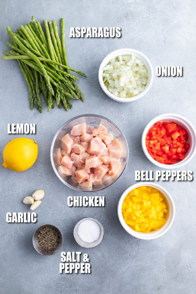 overhead shot of ingredients laid out to make spicy chicken pasta