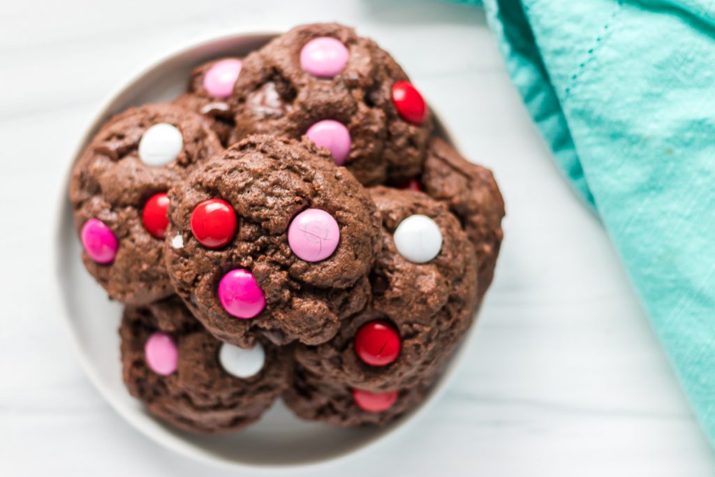 overhead shot of chocolate m&M cookies on a plate