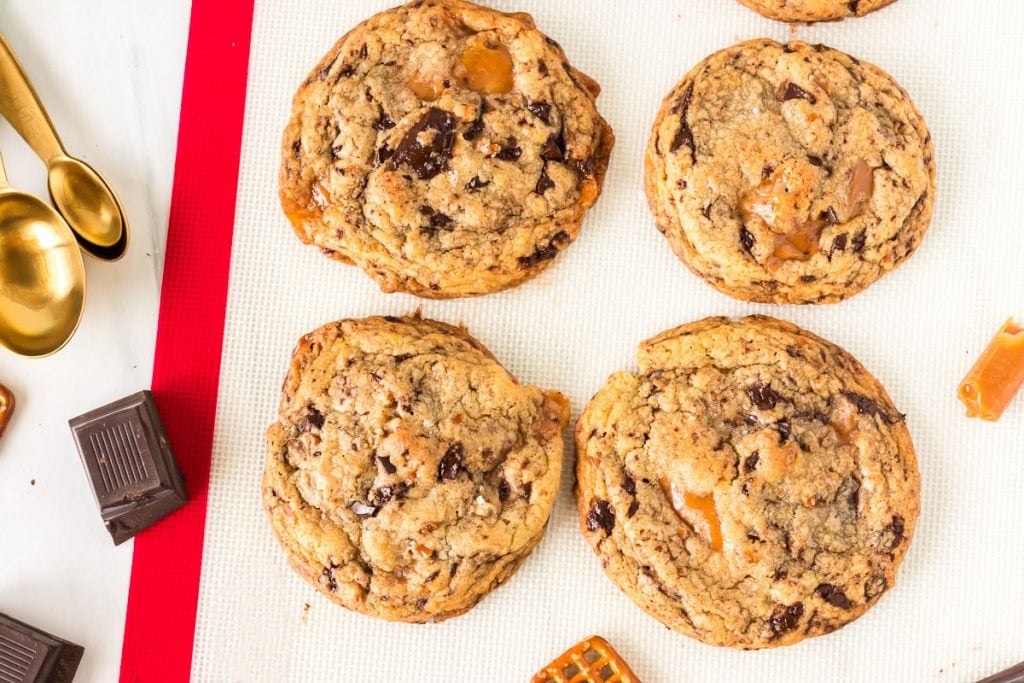 overhead shot of kitchen sink cookies on a silicone mat
