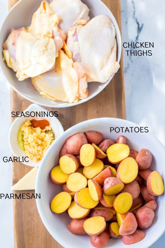 overhead shot of chicken, potatoes, and seasonings with text labels