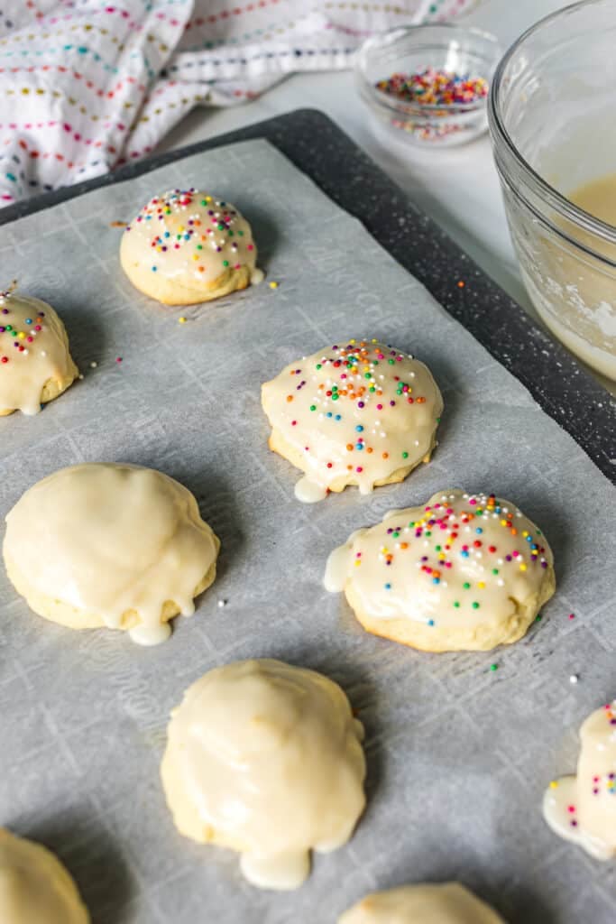 sugar cookies on a baking sheet with icing.