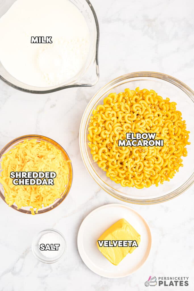 overhead shot of labeled ingredients laid out to make slow cooker mac & cheese.