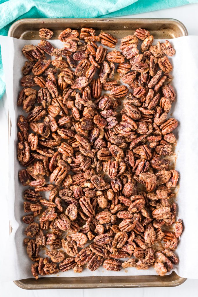 baking sheet full of candied pecans