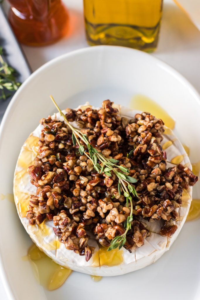 overhead shot of brie prepped to go into the oven