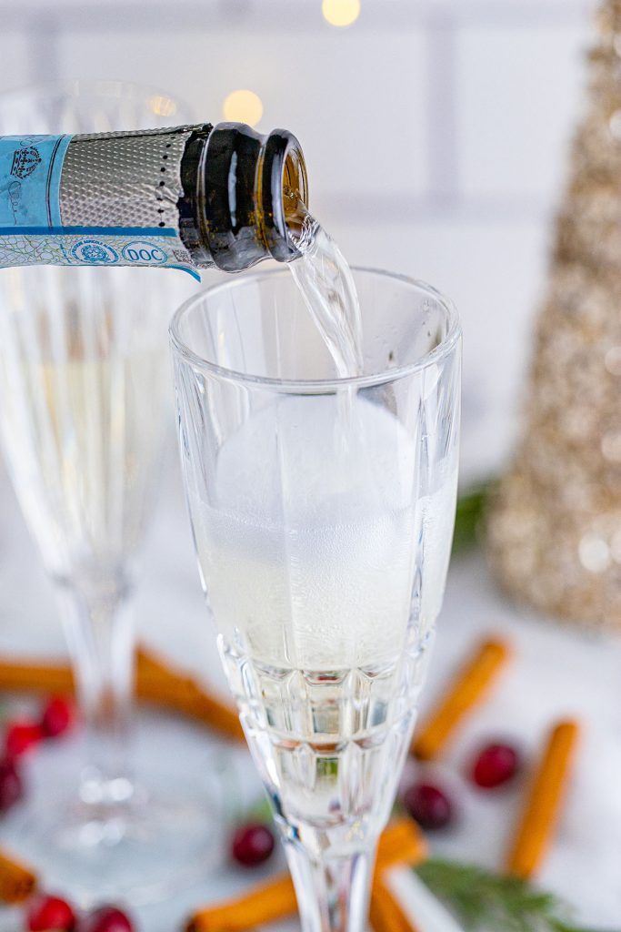 prosecco pouring into a champagne flute