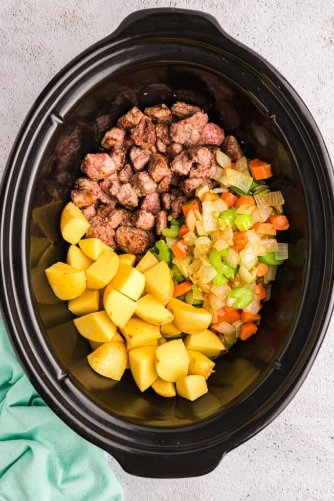 beef, potatoes, and sauteed vegges in a crockpot.