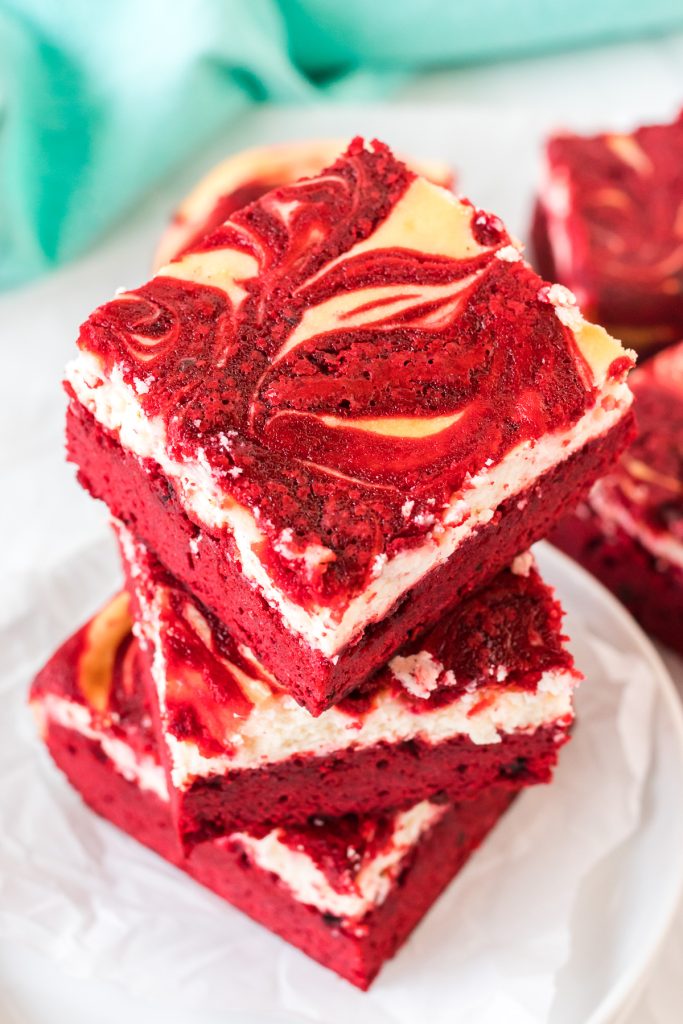 overhead shot of a stack of red velvet swirl brownies.