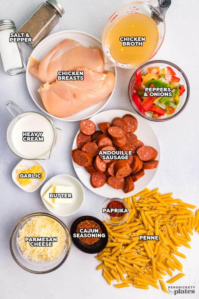 overhead shot of labeled ingredients laid out to make cajun chicken alfredo.