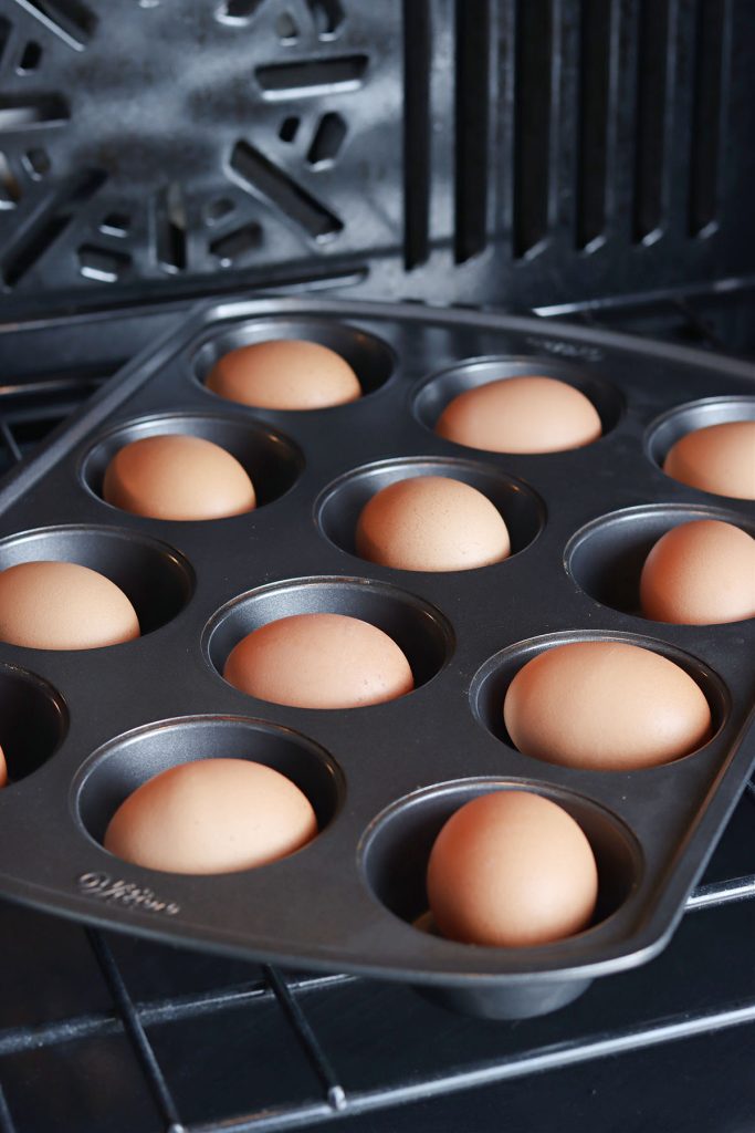 brown eggs in a muffin tin.