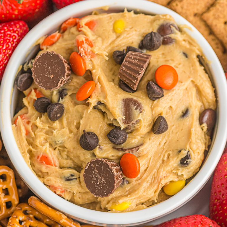 closeup overhead shot of peanut butter cup cookie dough dip topped with mini peanut butter cups.