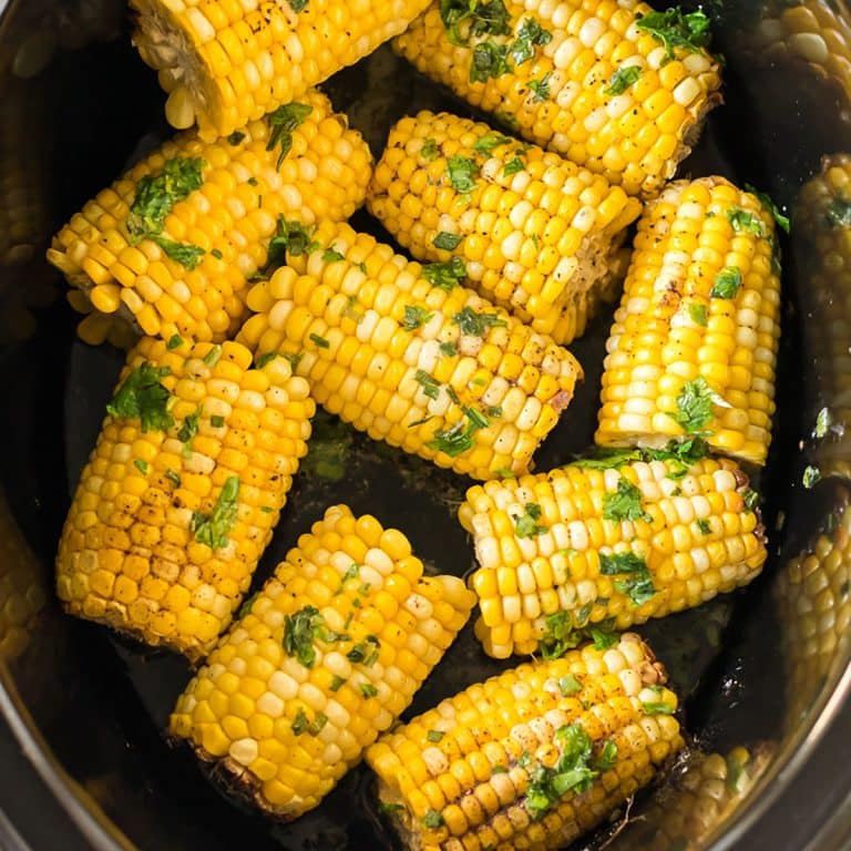 overhead shot of corn on the cob in a crockpot.