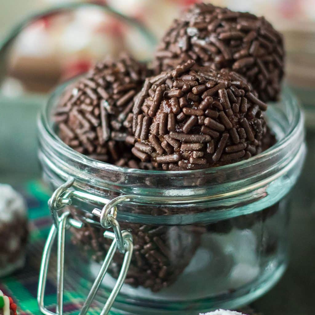 glass jar of chocolate rum balls.