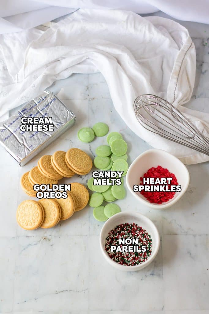 overhead shot of labeled ingredients laid out to make grinch oreo truffles.