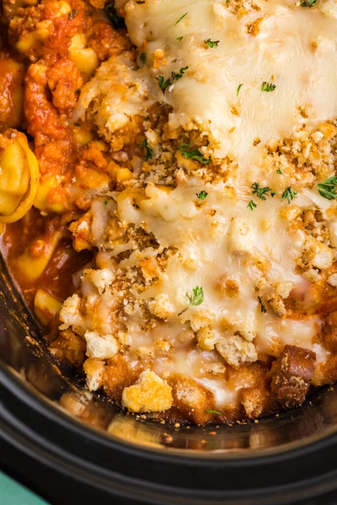 closeup of crockpot chicken parmesan with tortellini.