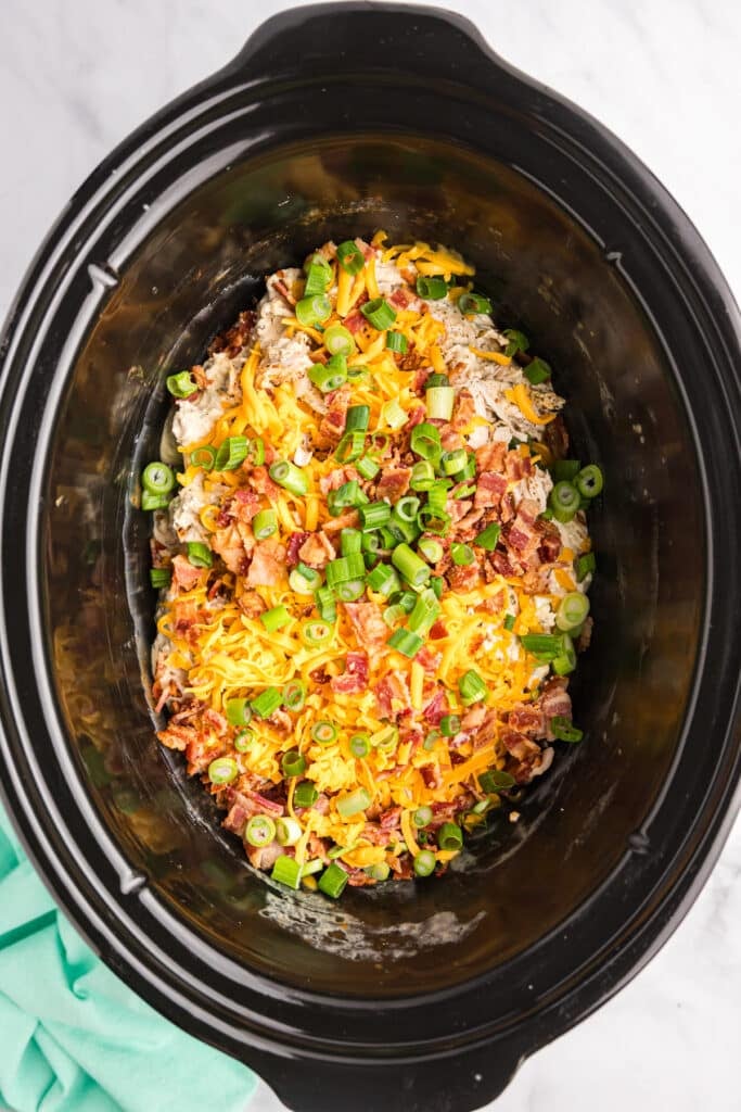 overhead shot of crack chicken in a slow cooker.