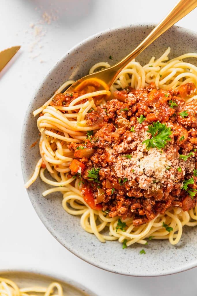 overhead shot of spaghetti with parmesan cheese.