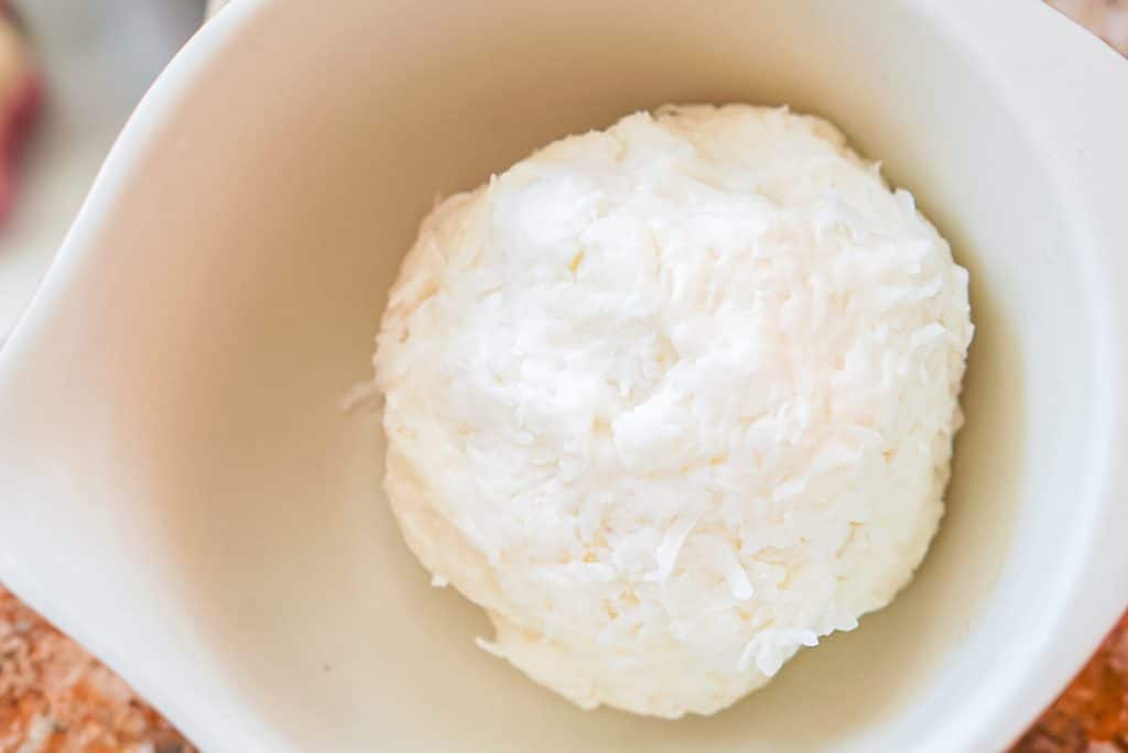 overhead shot of a bowl filled with a cream cheese mixture.