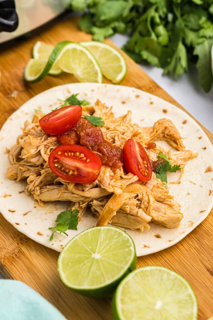 honey lime chicken taco on a board.