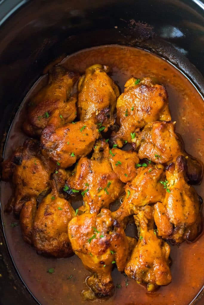 overhead shot of chicken wings in a crockpot.
